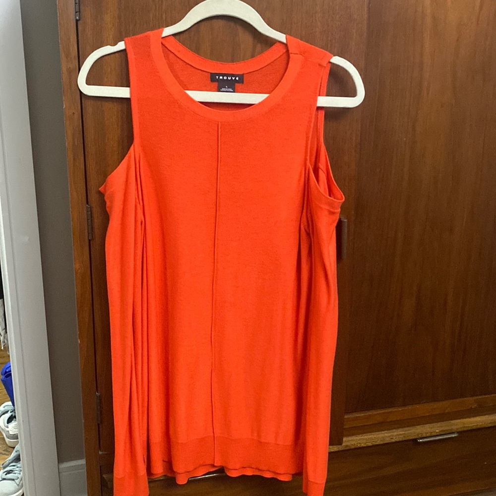 Reddish orange cold shoulder top.